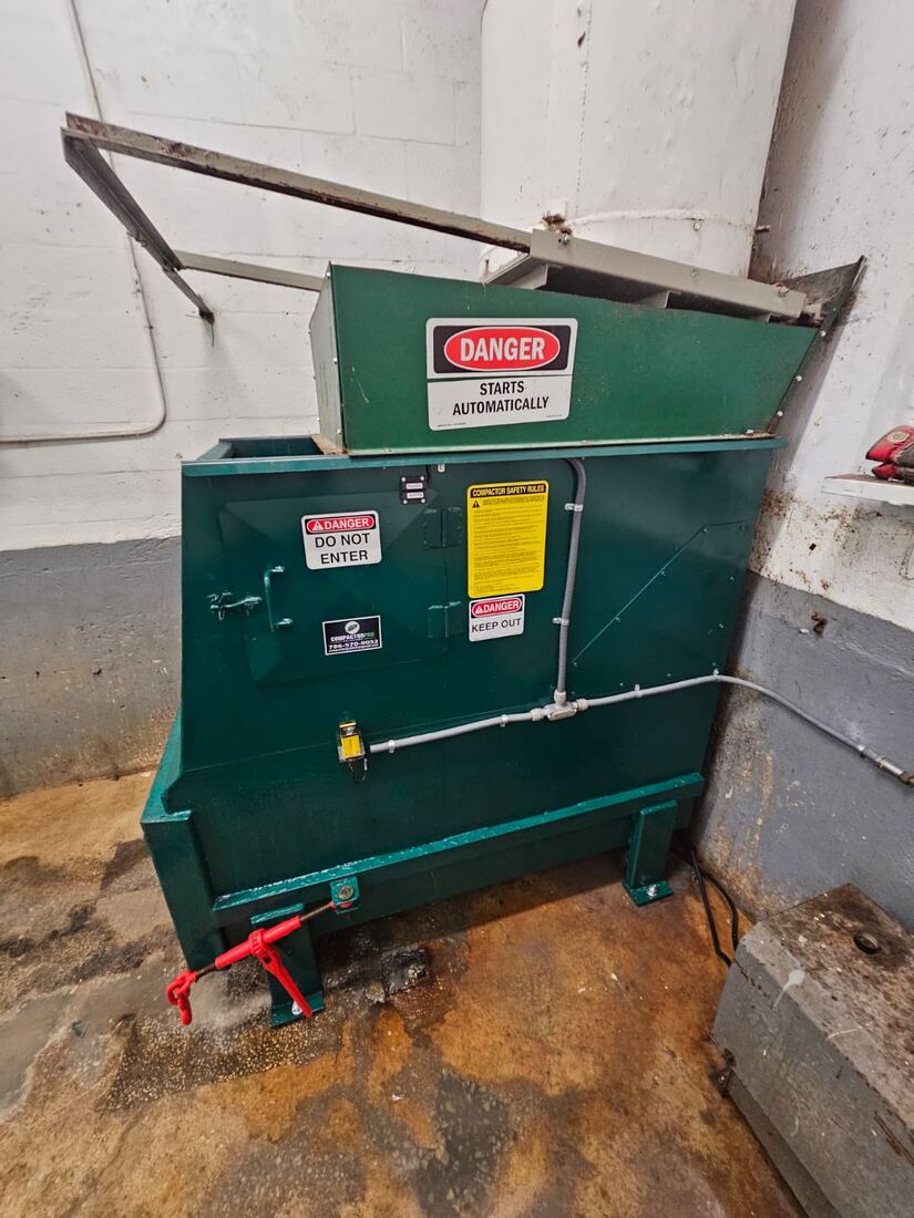 Compactor with safety guarding installed
