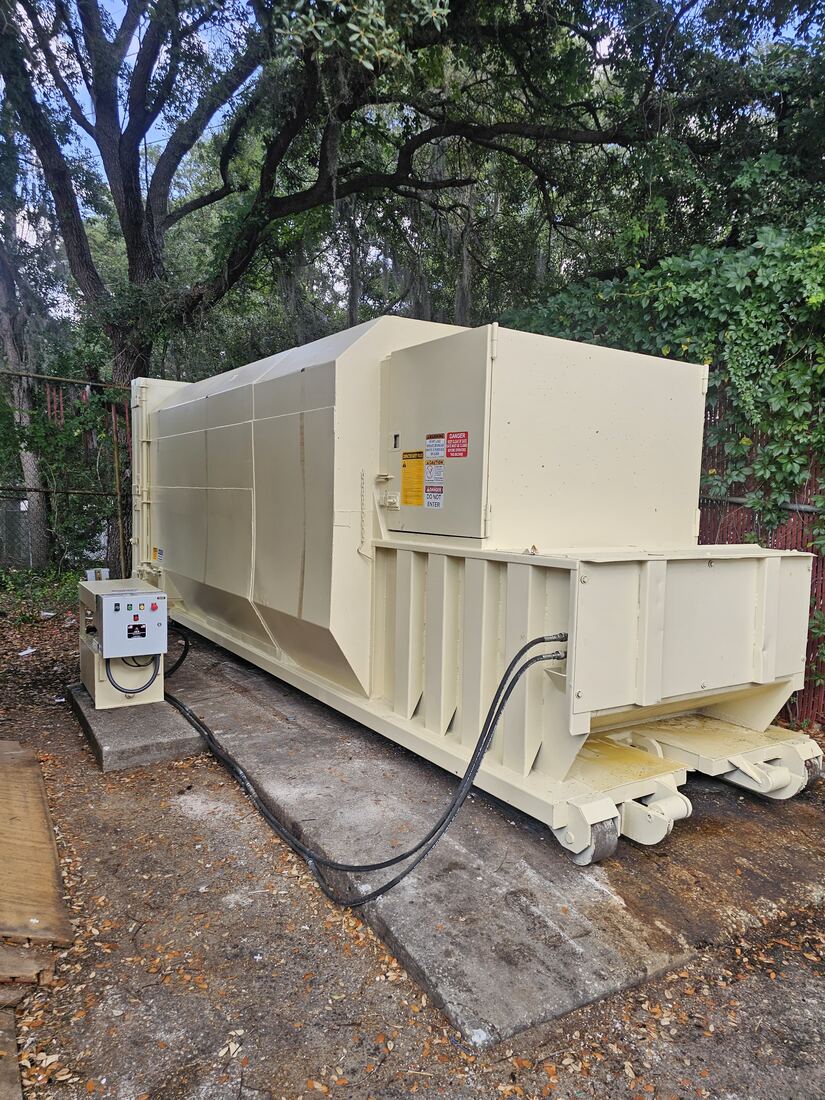 Heavy-duty waste compactor serviced on site